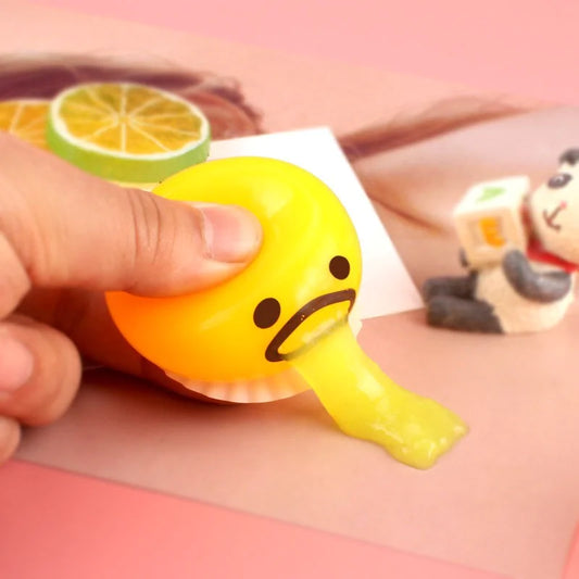 PUKING EGG YOLK SQUISH TOY